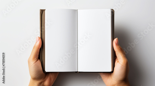 Hand opening book on white background