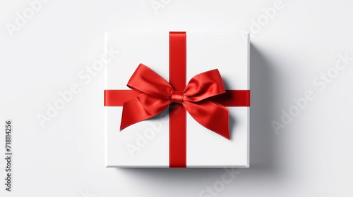 White gift box with red ribbon bow on white background © Inlovehem
