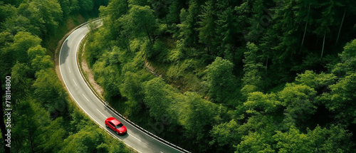 Aerial view car on the road in the green forest