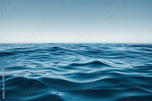 Fototapeta Naklejka Na Ścianę i Meble -  a flat and smooth water wave with blue sky over it