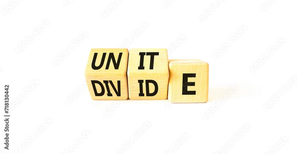 Unite or divide symbol. Concept word Unite or Divide on wooden cubes. Beautiful white table white background. Business unite or divide concept. Copy space. Unite or divide symbol. Concept word Unite or Divide on wooden cubes. Beautiful white table white background. Business unite or divide concept. Copy space.