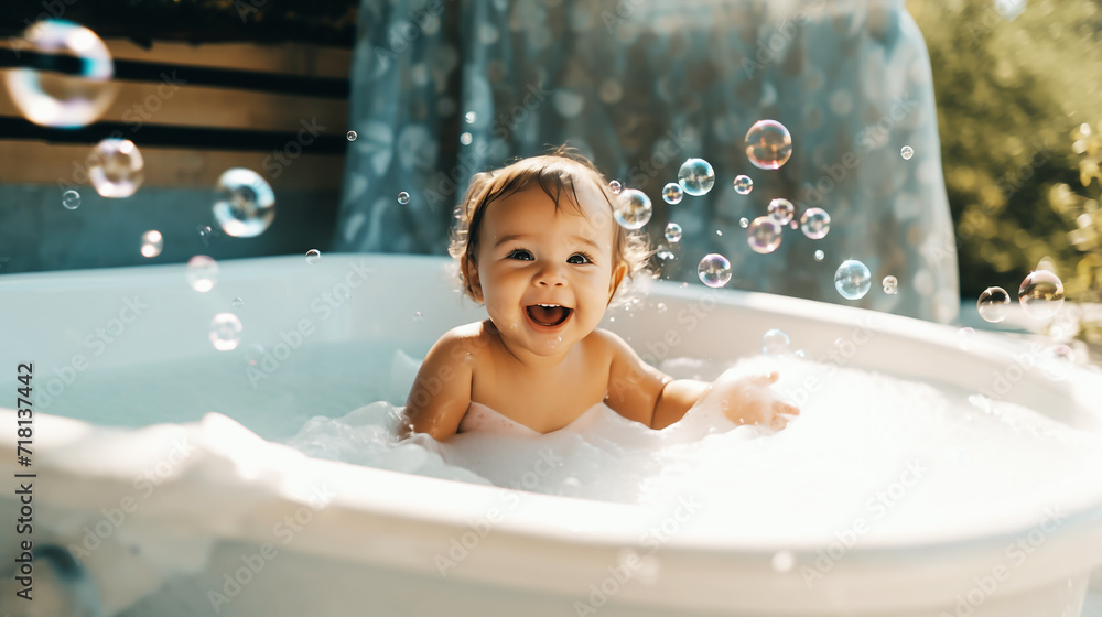 Baby laughs and is filled with soap bubbles in the bathtub Baby laughs and is filled with soap bubbles in the bathtub