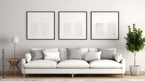 Gallery wall of Mockup poster blank frames above a Scandinavian-inspired sofa
