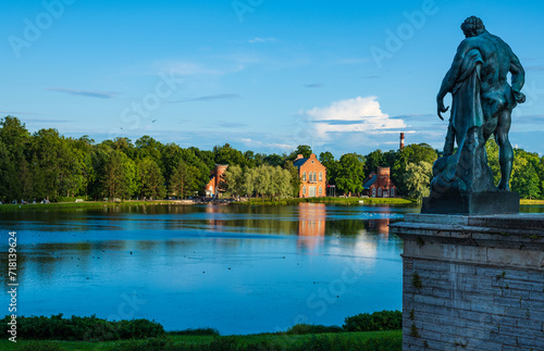 Sculpture of Hercules against the backdrop of a lake landscape in Catherine Park. photo