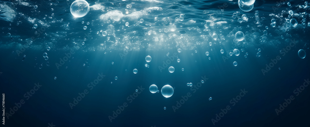 Sunlight filtering through ocean water creating bubbles