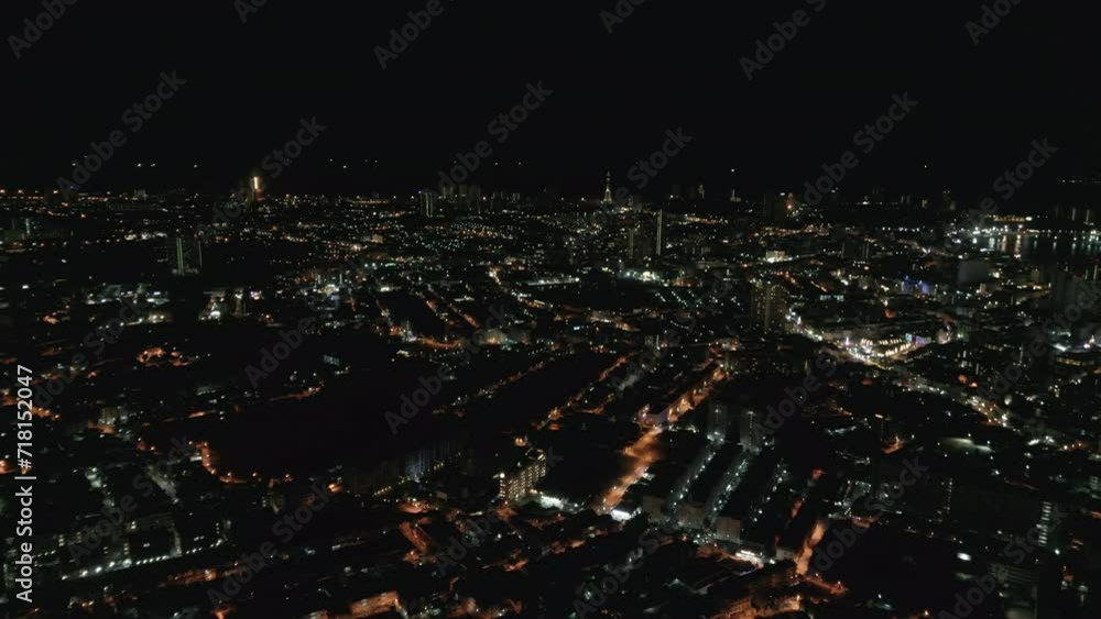 Night illuminated flight over a big city traffic aerial top down panorama 4k. Night evening roads of the city full of traffic Night illuminated flight over a big city traffic aerial top down panorama 4k. Night evening roads of the city full of traffic
