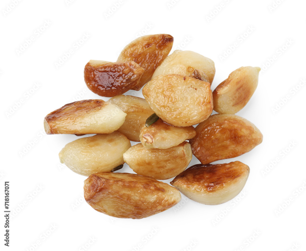 Pile of fried garlic cloves isolated on white, top view Pile of fried garlic cloves isolated on white, top view
