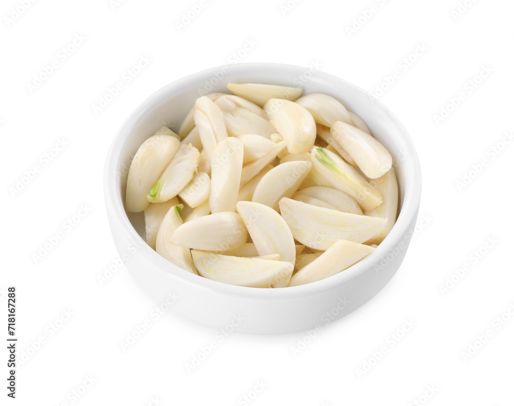 Peeled cloves of fresh garlic in bowl isolated on white Peeled cloves of fresh garlic in bowl isolated on white