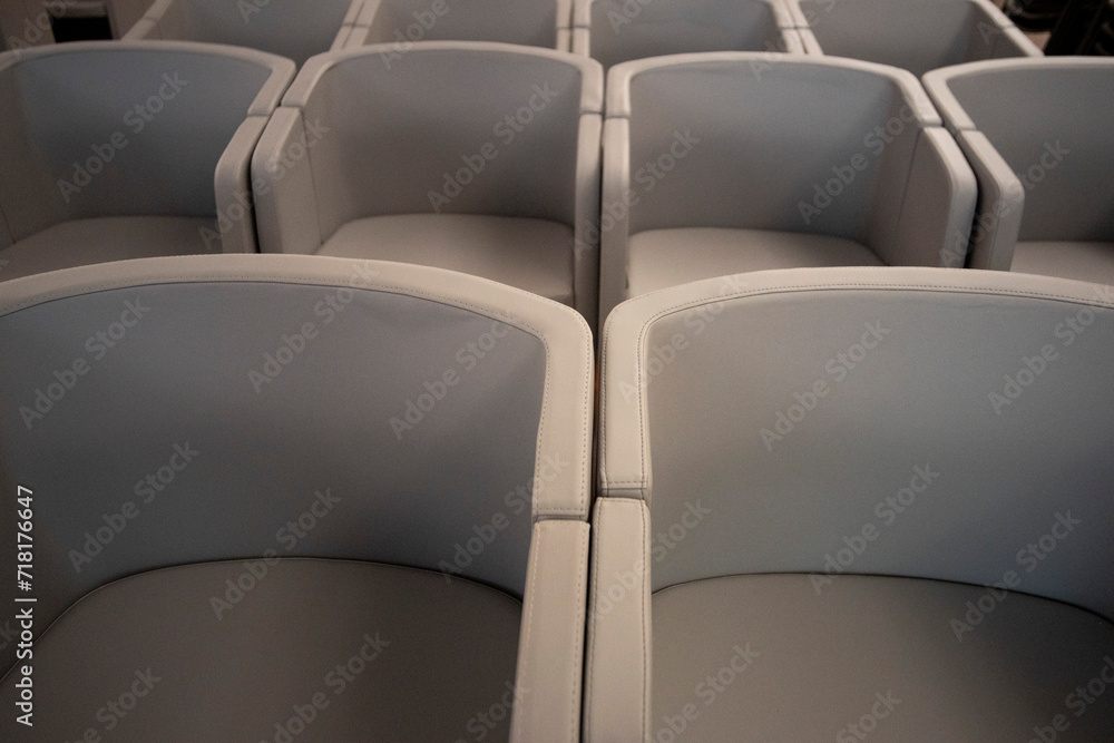 Obraz premium gray office armchairs arranged in a row