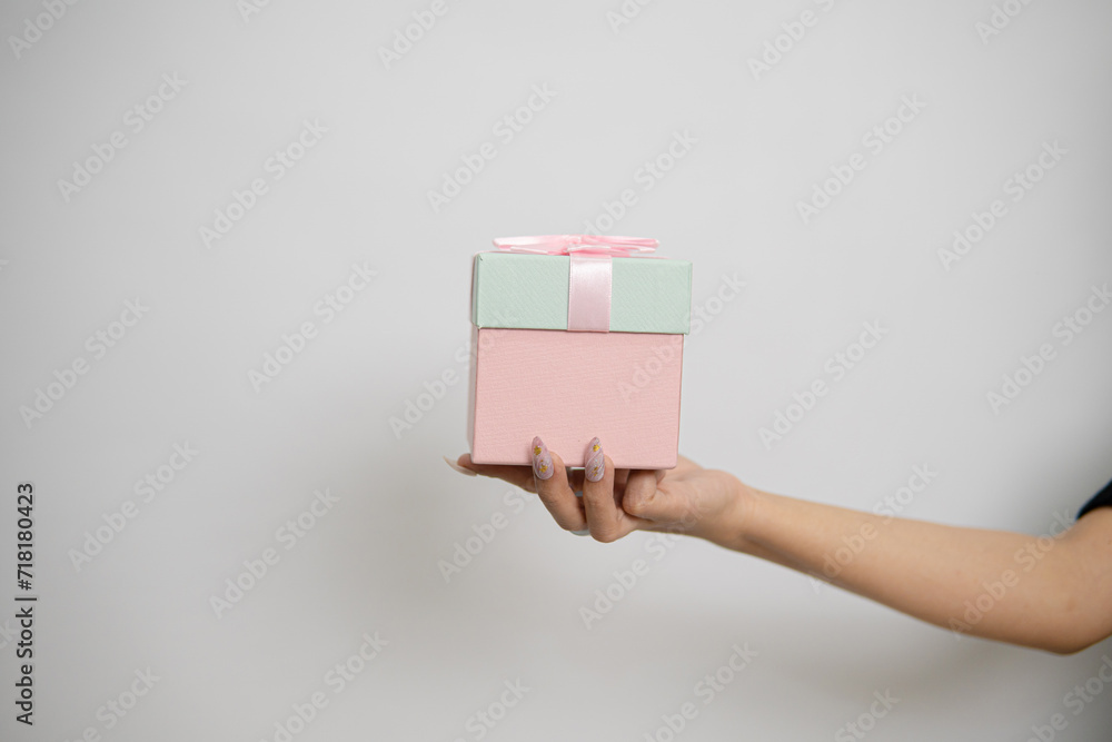 person holding a giftbox person holding a giftbox