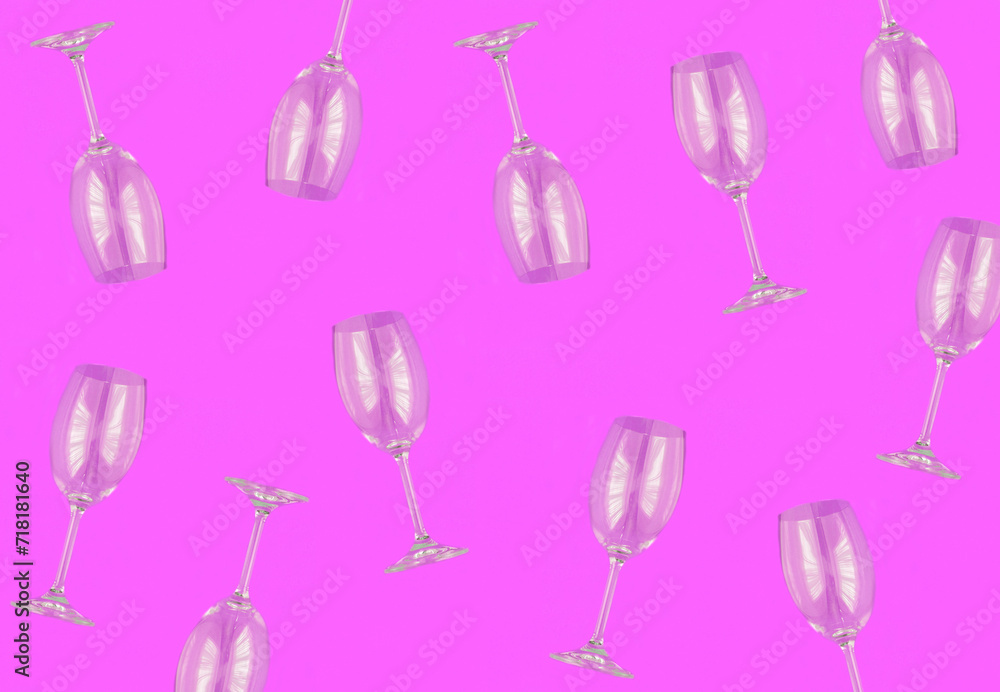 Empty wineglasses on the pink background. Top view. Pattern. Flat lay.