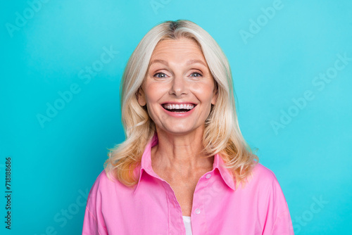 Photo portrait of lovely senior lady cheerful excited smile wear trendy smart casual garment isolated on cyan color background