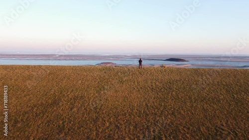 An aerial view of the Dutch flat landscape at the Ossenisse observation tower during the soft light of sunrise photo