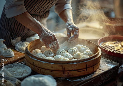 Person making Chinese dim sum, in a bamboo steamer box
