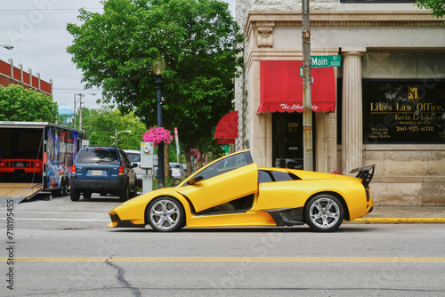Принти на полотні Yellow Sports Car with Gullwing Doors on City Street