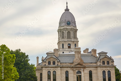 Classical Courthouse with Clock Tower and Lush Trees, Low Angle View