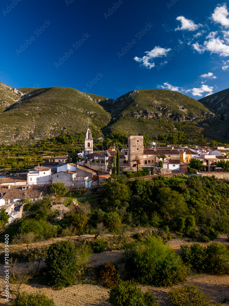 Aerial view of Almudaina village with its church and the famous medieval tower , Alicante, Costa Blanca, Spain - stock photo