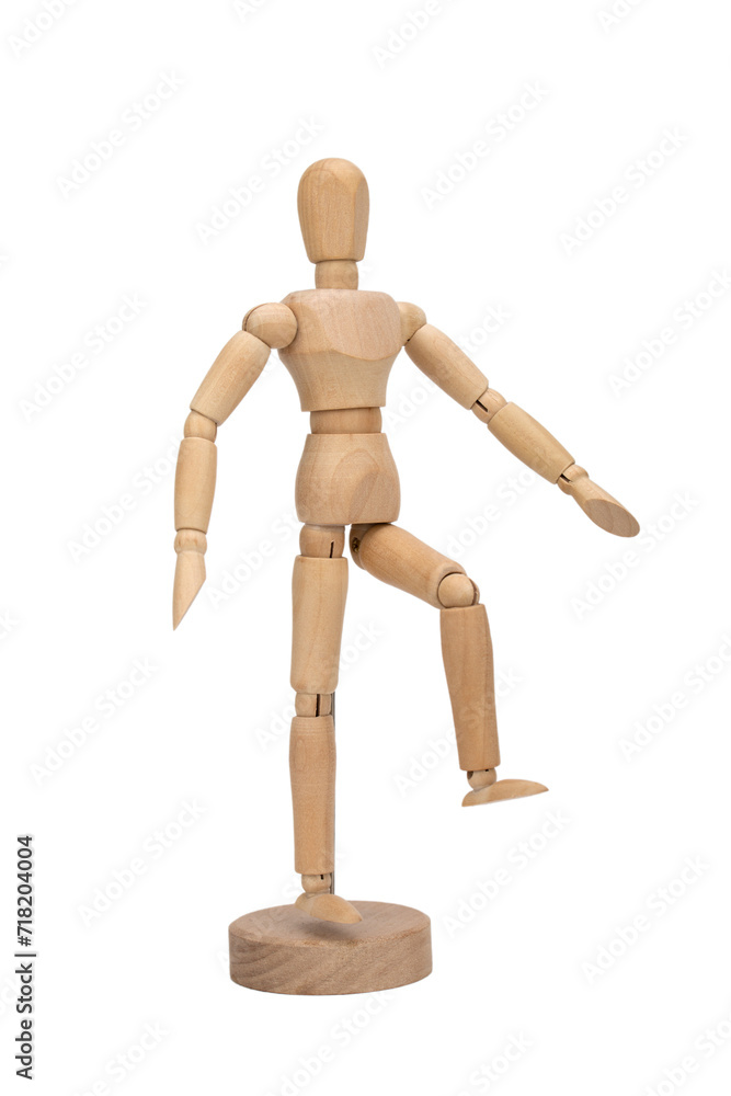 Wooden figure of a man isolated on white background. Wooden mannequin in step pose. Wooden figure of a man isolated on white background. Wooden mannequin in step pose.