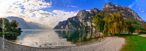 Italy travel ,scenic Garda lake , Trento province.  Lago di Garda. Wonderful autumn scenery. sunny morning in Riva del Garda. photo
