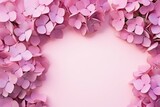  a bunch of pink flowers on a pink background with a place for a text or an image to put on a card or brochure with a place for text.