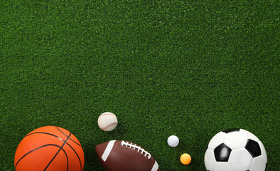 Many different sports balls on green grass, flat lay. Space for text