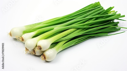 vibrant green of fresh spring onions on a white wooden table.