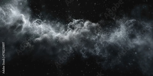 A black and white photo capturing a cloud of powder. This image can be used to depict concepts of celebration, energy, explosion, or creativity.