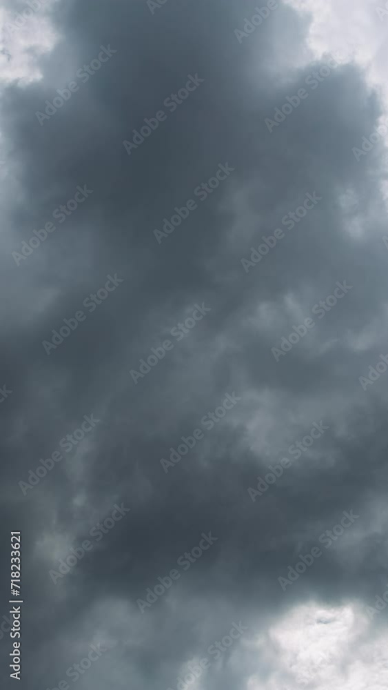 Vertical video - Timelapse of dark ominous storm clouds forming and dissolving Vertical video - Timelapse of dark ominous storm clouds forming and dissolving