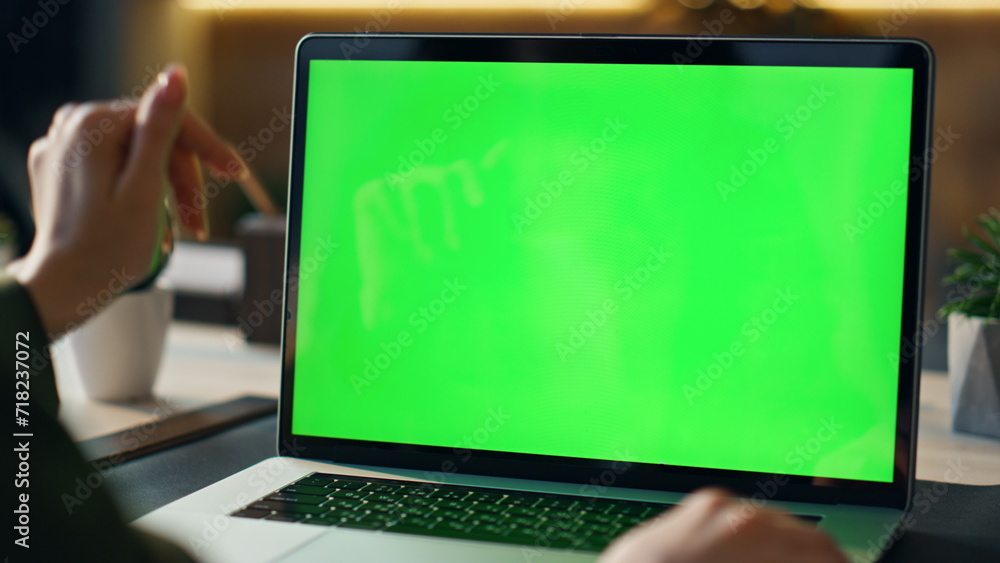 Greenscreen laptop user videocalling at desk close up. Boss video conference Greenscreen laptop user videocalling at desk close up. Boss video conference