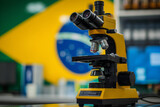 Microscope against the background of the Brazil flag