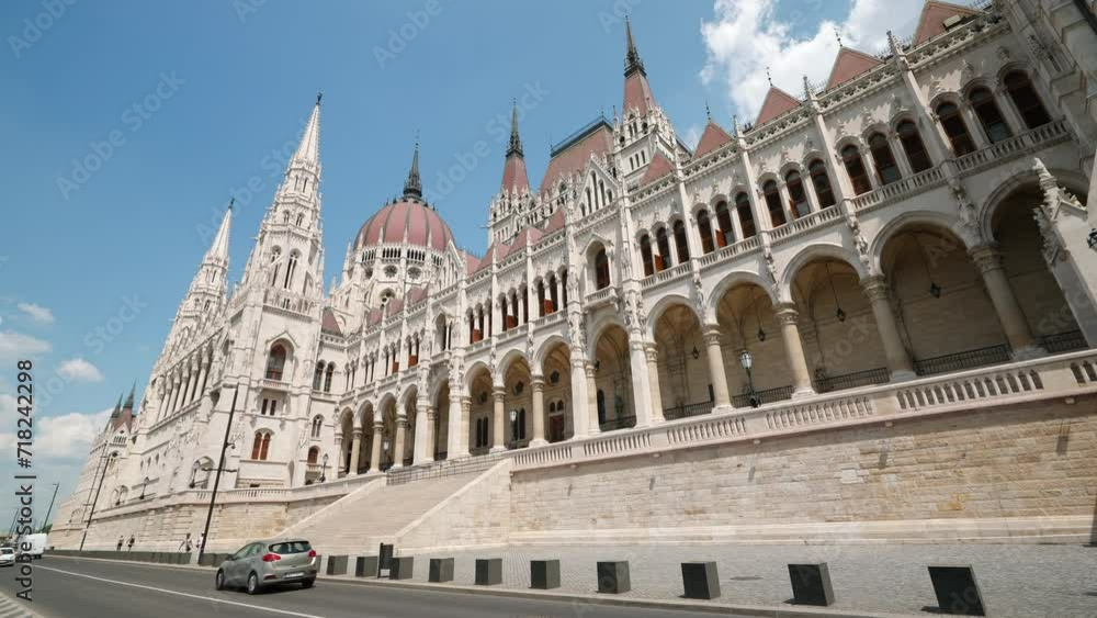 Residence of Hungarian Parliament, Budapest against backdrop blue sky on sunny day in summer. National building symbol side view. Travel. Tourism Residence of Hungarian Parliament, Budapest against backdrop blue sky on sunny day in summer. National building symbol side view. Travel. Tourism