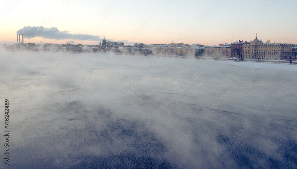 Evening mist above river and industrial pipes with smoke, St.Petersburg Evening mist above river and industrial pipes with smoke, St.Petersburg