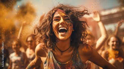 Fun with colours: A vibrant splash of colors and a young woman celebrating holi festival outdoors