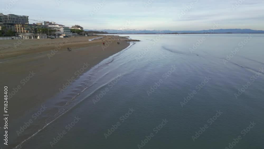 Sunset on the coast of Lignano Sabbiadoro. Punta Faro pier and Sea Terrace. Sunset on the coast of Lignano Sabbiadoro. Punta Faro pier and Sea Terrace.