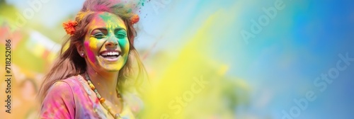 portrait happy smiling young girl celebrating holi festival, colorful face, vibrant powder paint explosion, joyous festival. photo
