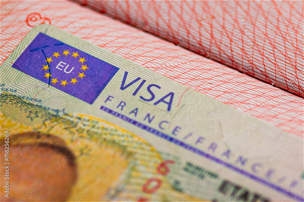 Fototapeta premium Schengen visa of France in the passport, closed border of EC. Close-up