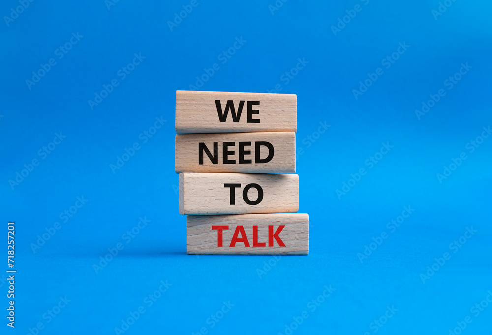 We need to talk symbol. Concept words We need to talk on wooden blocks. Beautiful blue background. Business and We need to talk concept. Copy space. We need to talk symbol. Concept words We need to talk on wooden blocks. Beautiful blue background. Business and We need to talk concept. Copy space.