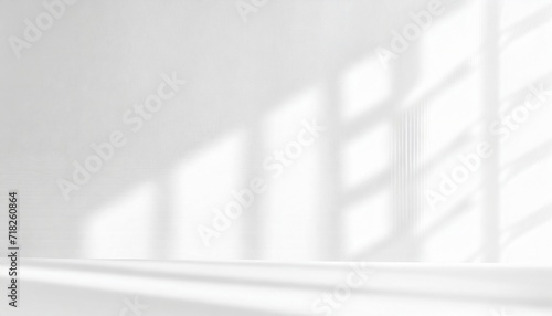 realistic and minimalist blurred natural light windows shadow overlay on wall paper texture abstract background minimal abstract light white background for product presentation