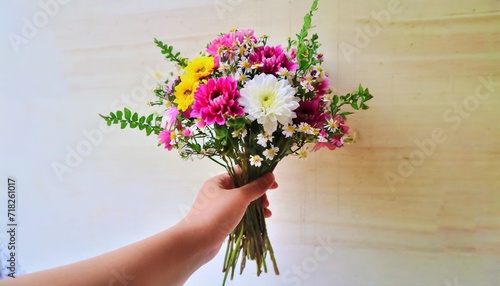 hand holding bouquet of flower