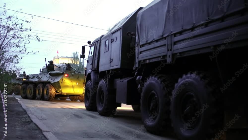 Soldiers with rocket launchers on shoulders riding on armored vehicles Soldiers with rocket launchers on shoulders riding on armored vehicles