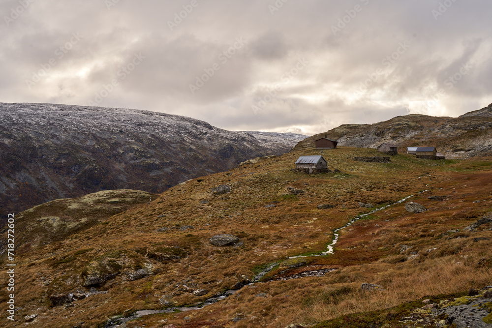 Very old, simple, traditional stone and log cabins on the Aurland highland in Norway during late autumn
