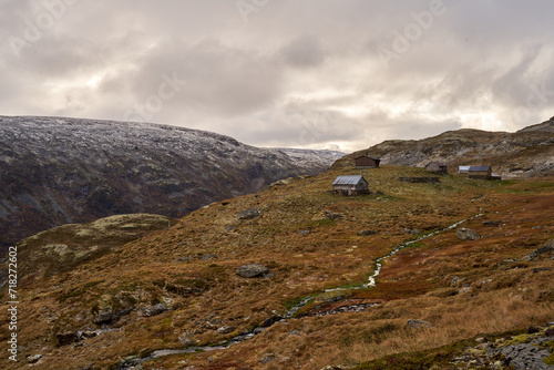Fototapeta Naklejka Na Ścianę i Meble -  Very old, simple, traditional stone and log cabins on the Aurland highland in Norway during late autumn