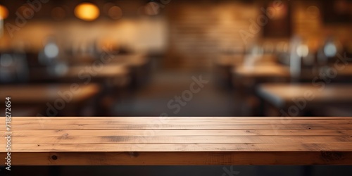 Coffee shop background with empty wood table top for product display template. © Sona