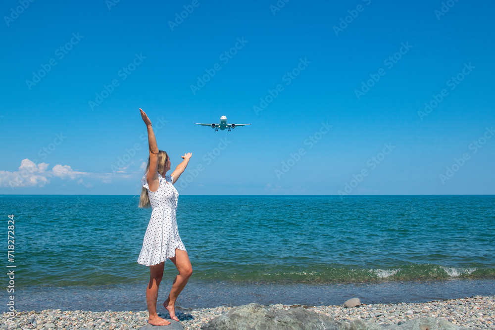 Skybound Connection: Girl in White Dress Meets a Plane Above the Blue Sea Skybound Connection: Girl in White Dress Meets a Plane Above the Blue Sea