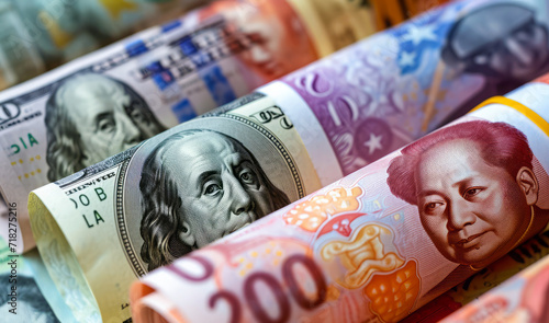 Money rolls, currencies from different countries. Yuan and dollar banknotes, investment and economy
