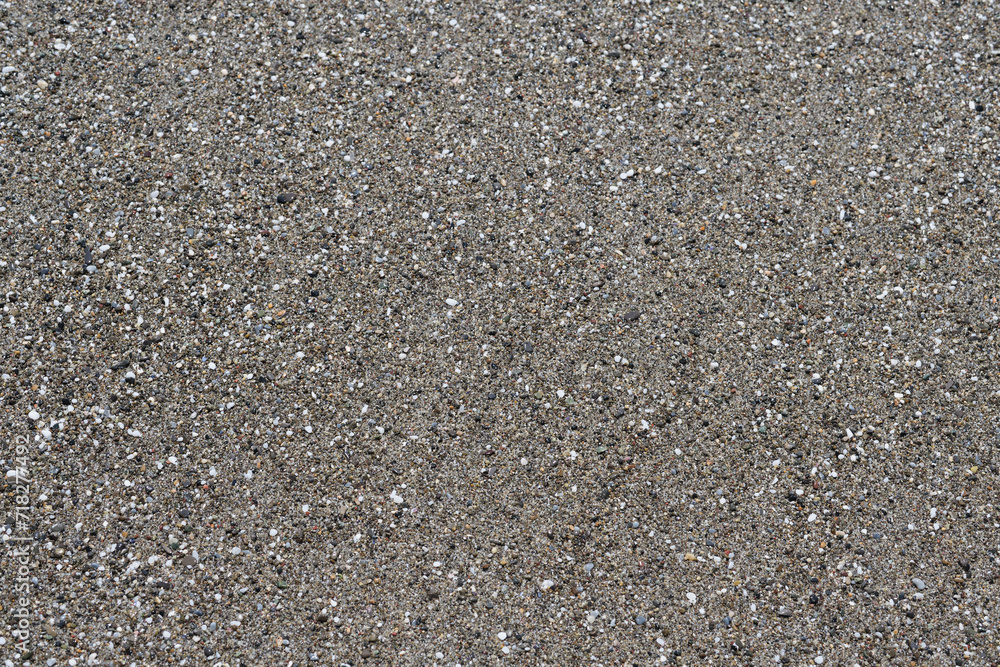 Sea coarse sand top view flat layout. Gray coarse sea sand on the seashore. Sea sand closeup flat lay. Sea coarse sand top view flat layout. Gray coarse sea sand on the seashore. Sea sand closeup flat lay.