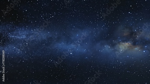Deep blackness of the night sky filled with countless twinkling stars, creating a sense of vastness and infinity. Mysterious background. Concept of astronomy, cosmos, space exploration, stargazing.