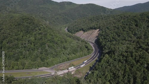 Trucks running up and down the interstate in between beautiful mountains in North Carolina