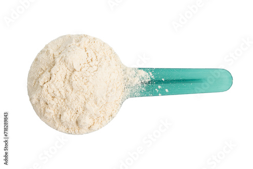 Whey protein powder in a plastic measuring spoon, isolated on transparent background, top view