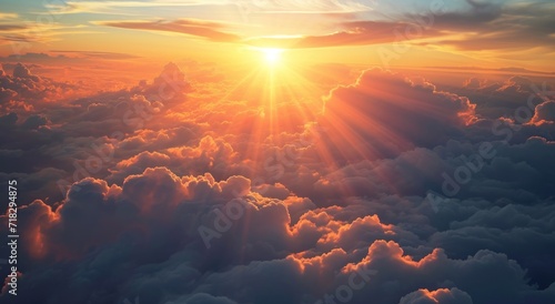  the sun shines brightly through the clouds in this view of the earth's atmosphere, as seen from the window of an airplane in flight above the clouds.